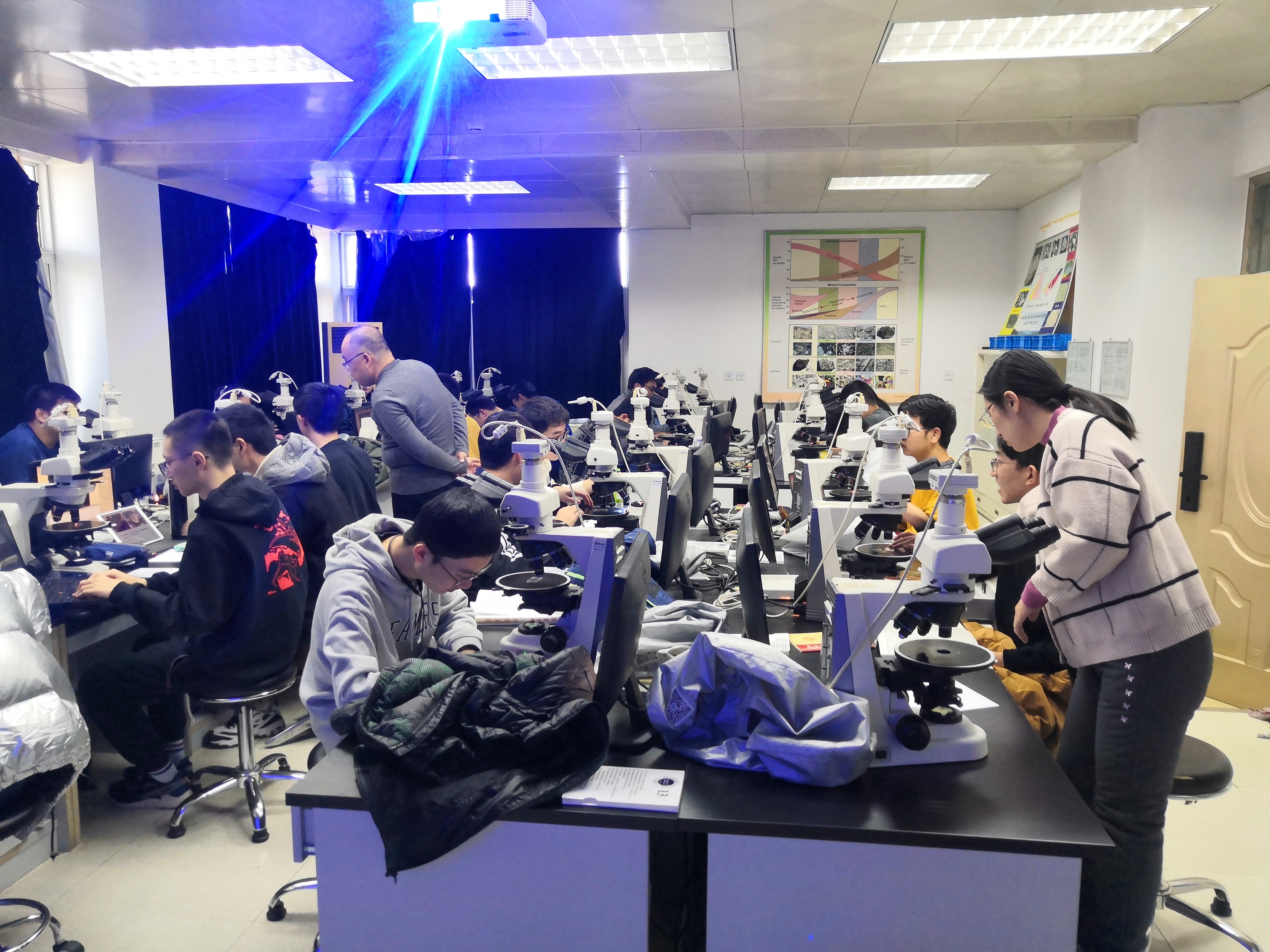 Students are observing thin sections of igneous rocks, on 8th November 2021.